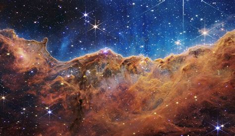 Nasas Webb Reveals Cosmic Cliffs Glittering Landscape Of Star Birth