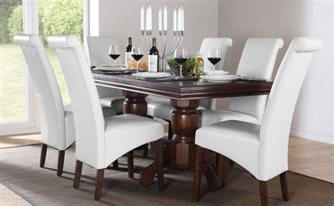 With its contoured x back and comfortable, carved seat, our vintner side chair supports you in all the right places. dark wood dining table with white upholstered chairs ...