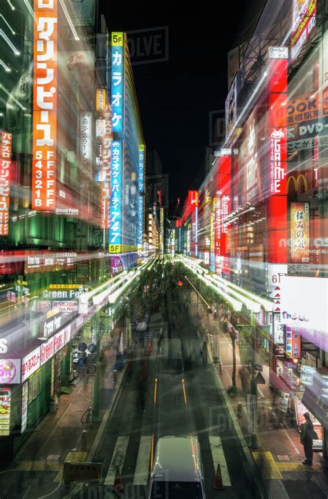 Tokyo City Street Lit Up At Night Tokyo Japan Stock Photo Dissolve
