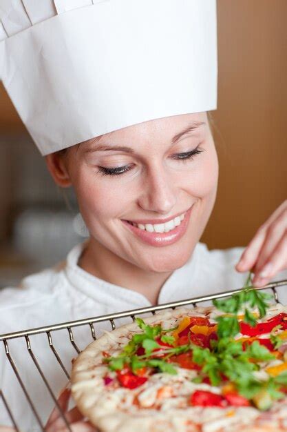 Premium Photo Smiling Female Chef Preparing A Pizza