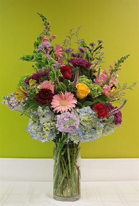 Our gardens are a unique space, use this day to get out there and make the most of them. Floral Arrangement in Bergen County, NJ | Flor Bella Designs