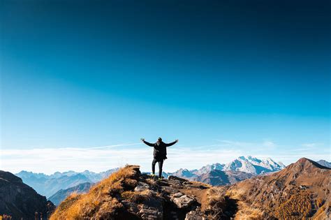 Man Standing On Top Of The Mountain Free Stock Photo Picjumbo