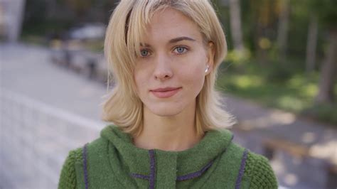 Close Up Face Of Young Blond Caucasian Woman With Short Hair Smiling