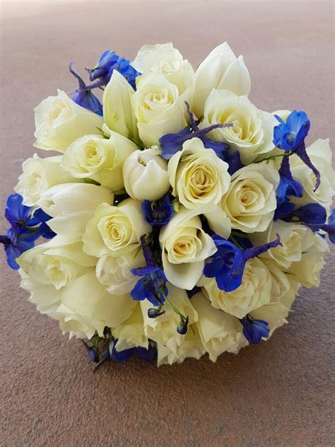 A Natural Handtied Bouquet Of Cream Roses With White Tulips With S