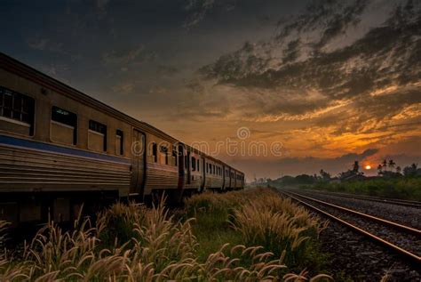 Train Passing By Over Rural Railway In The Morning Or At Dawn Wi Stock