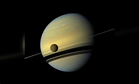 Saturns Largest Moon Is Drifting Off Into Space 100 Times Faster Than