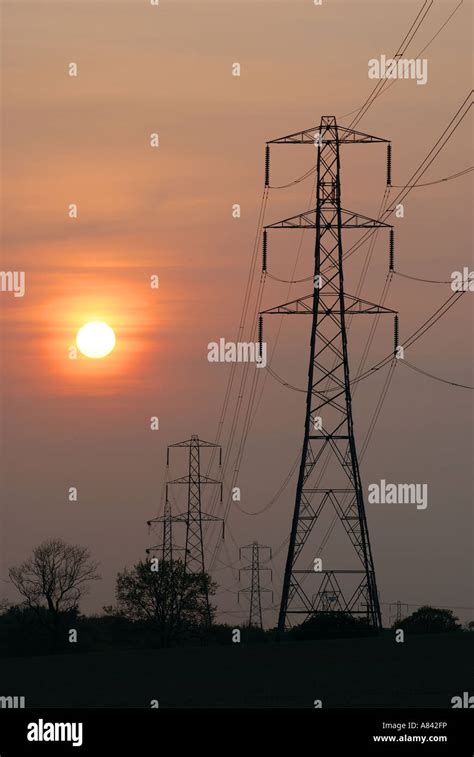 Electricity Pylons At Sunset Uk Stock Photo Alamy