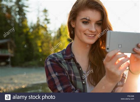 Smiling Young Woman Taking Selfie Stock Photo Alamy