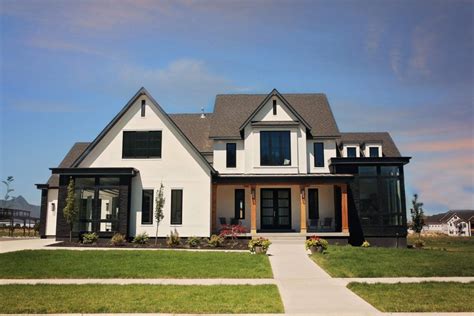 House has light beige siding; 10 Gorgeous Farmhouse Exteriors - White farmhouse ...