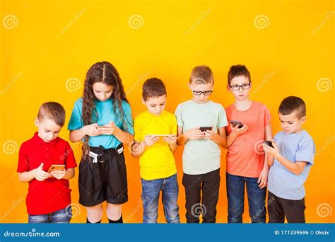 Young Kids Playing Game On Mobile Phone Stock Photo Image Of Gaming