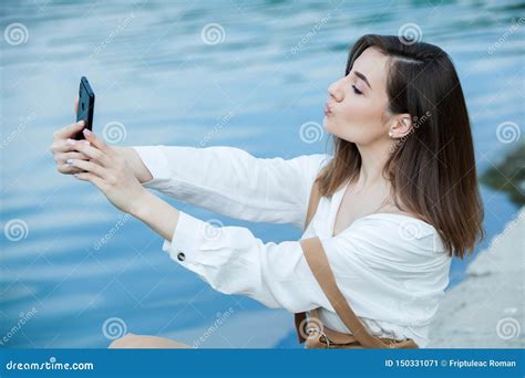 Girl Outdoors Texting On Her Mobile Phone Girl With Phone Portrait Of A Happy Woman Text Sms