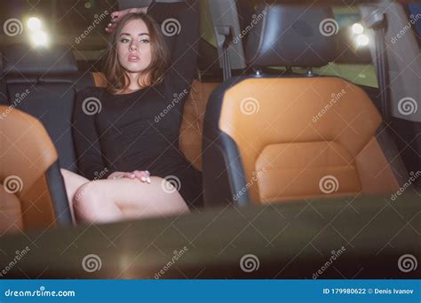 Sexy Girl In The Back Seat Of A Prestigious Car Stock Photography
