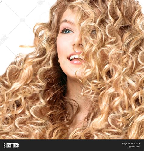 Beauty Girl With Blonde Curly Hair Healthy And Long Permed Blond Wavy