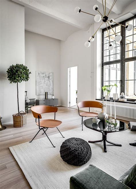 Scandinavian Livingroom With Highceilings And Larger Than Life
