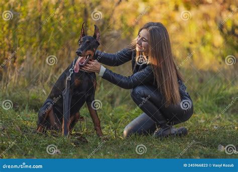 Girl Sitting Near A Doberman Dog Stock Image Image Of Dynamic Couple