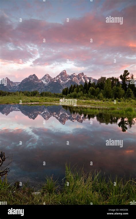 Wy02062 00wyoming The Tetons Reflecting In A Beaver Pond On The