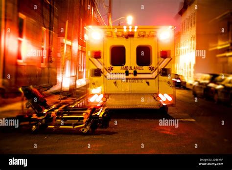 An Ambulance Car Parked On The Side Street At Night Stock Photo Alamy