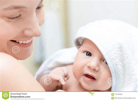 Mother Holding Infant Baby After Bathing Cute Child In
