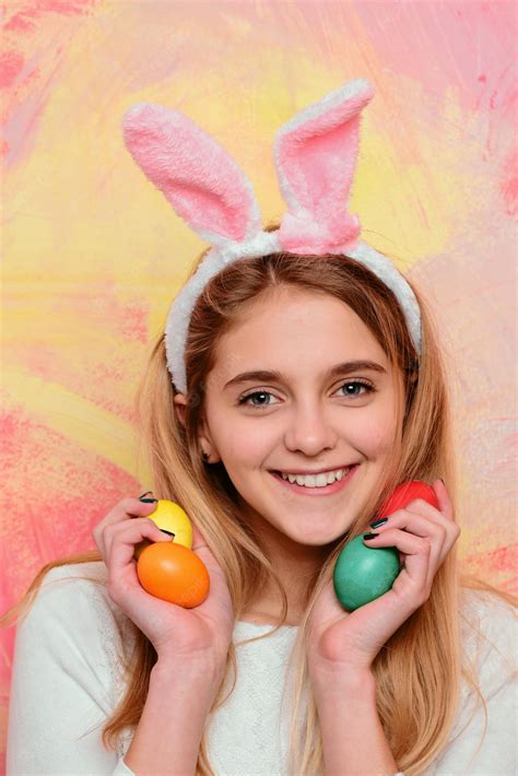 Premium Photo Girl In Costume Easter Bunny Rabbit With Ears And Eggs