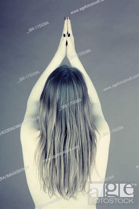Naked Woman From Behind With Her Arms Raised Stock Photo Picture And