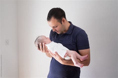 Father Holding His Baby Girl Del Colaborador De Stocksy Branislava