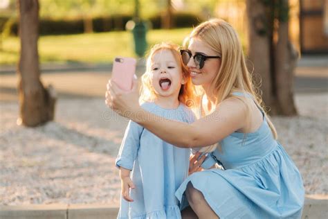 Mom And Her Little Daughter Make Selfie In The Park Stock Image Image Of Lifestyle Park