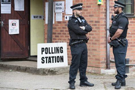 Polling Stations Patrolled By Armed Police As Millions Turn Out To Vote In General Election