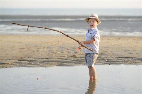 Child Is Fishing On The Beach At The Seaside Stock Image Image Of