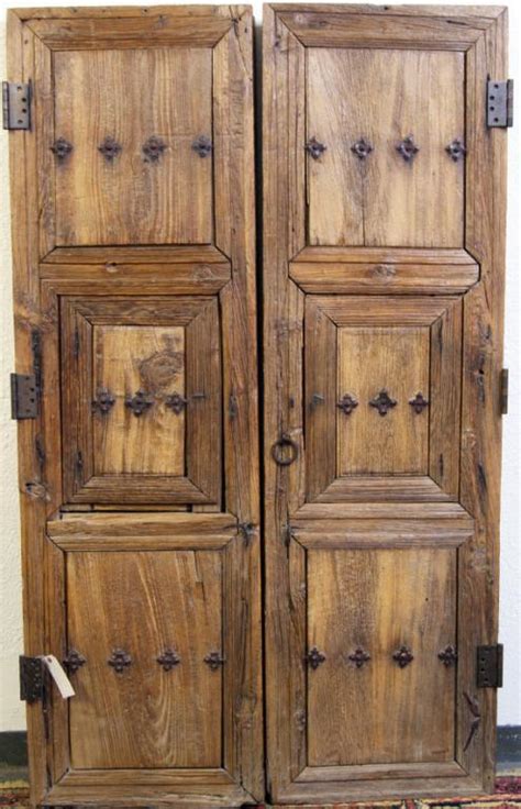 Pair Sabino Spanish Colonial Tooled Wood Doors