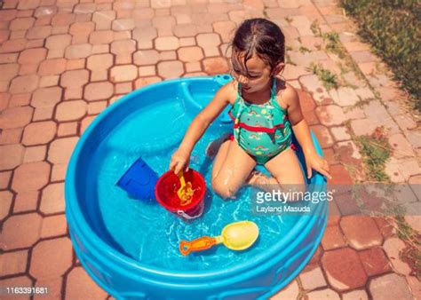 Kids Playing Backyard Pool Photos And Premium High Res Pictures Getty