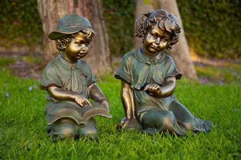 Boy And Girl Reading Together Statue Traditional Garden Statues And