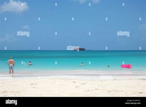 People Enjoying The Beautiful Caribbean Beach On The Shoreline Of St