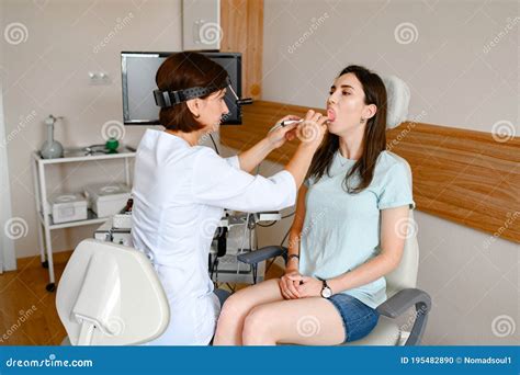 Female Ent Doctor And Patient In Office Exam Stock Photo Image Of