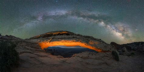 Mesa Arch Lit Up At Night With Milky Way Galaxy Above Stock Image