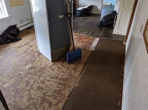 My hand is now a claw from gripping the paint brush so long, but there's. Pulled up a vinyl floor, found hardwoods! Would you ...