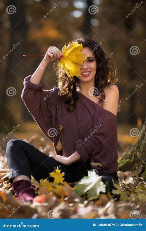 A Portrait Of A Beautiful Young Woman In An Autumn Forest Lifestyle