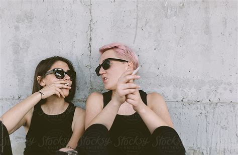 cool lesbian couple smoking del colaborador de stocksy alexey kuzma stocksy