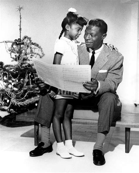 Nat King Cole Sharing A Tender Holiday Moment With His Daughter Natalie
