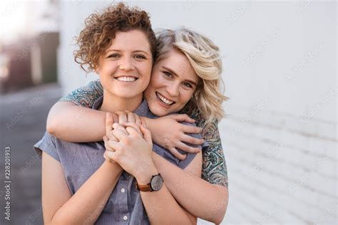 Smiling Babe Lesbian Couple Standing Affectionately Together Outdoors Stock Photo Adobe Stock