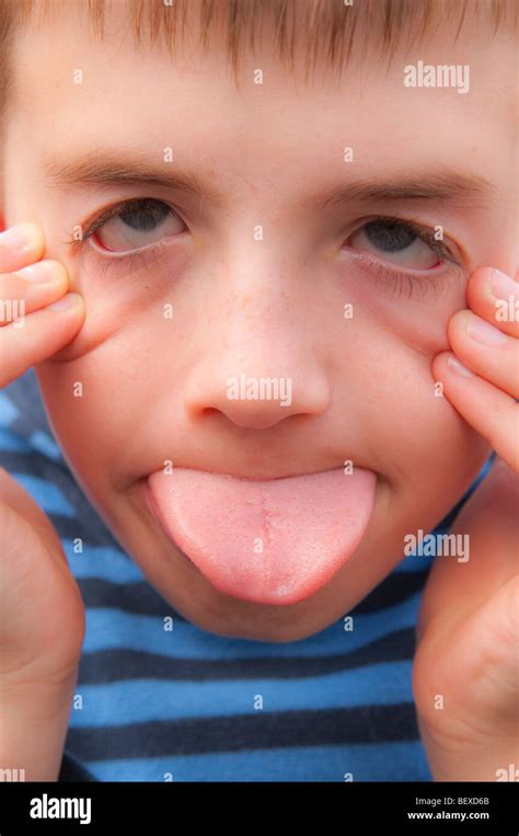 A Model Released Nine Year Old Boy Pulling A Silly Face In The Uk Stock