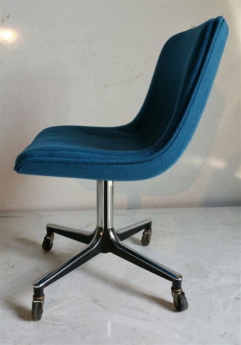 The seat is plushy and conforms to your bottom perfectly, the same material is the color and style of the chair really fits the aesthetic of my room and makes it have a more modern feel. Goodform Rolling Desk Chair, Mid-Century Modern at 1stDibs