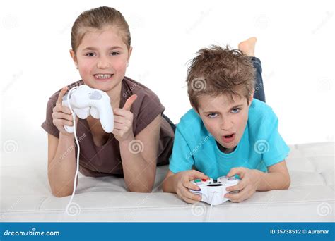 Children Playing Computer Games Stock Photo Image Of Floor Excited