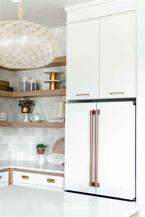 Our white appliances are definitely a different white from our cabinets and the counter tops are a different white unto themselves. GE Cafe appliances in white were used throughout this ...