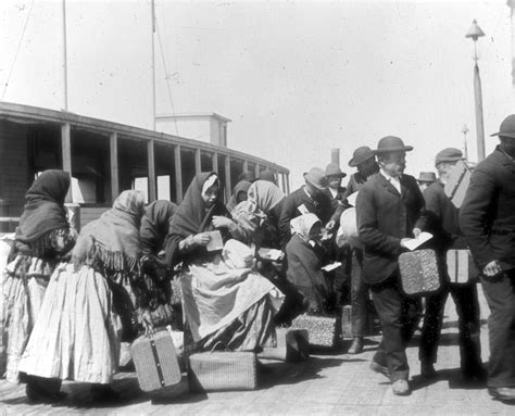 A Photograph Of Immigrants Arriving At Ellis Island Ca 1900 Dpla