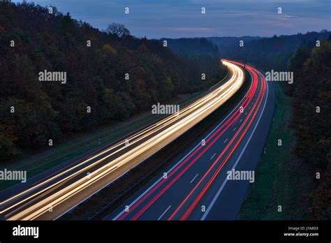 Traffic Light Trails On Motorway At Twilight Bavaria Germany Stock