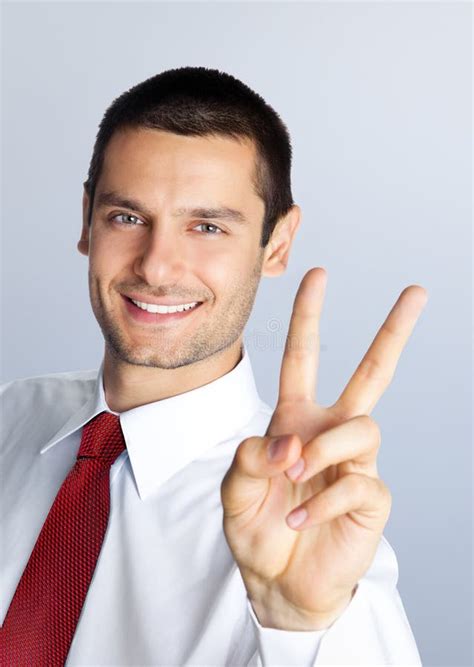 Businessman Showing Two Fingers Or Victory Hand Sign Gesture Stock