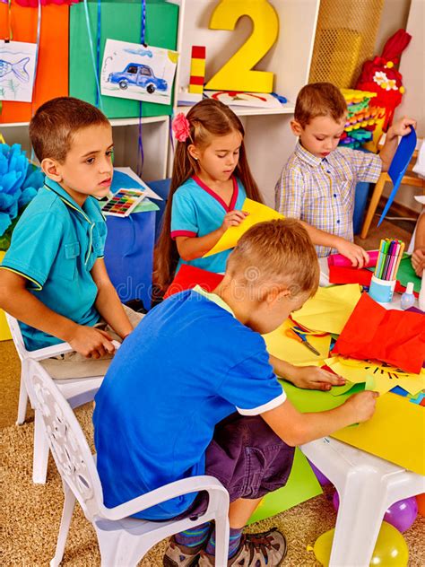 Group Kids With Brush Painting In Kindergarten Stock Photo Image Of