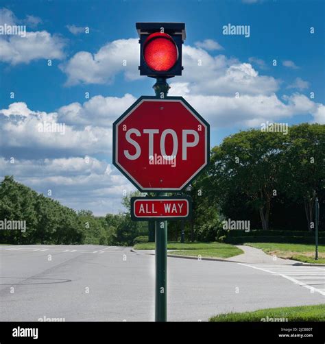 Stop Sign With Red Traffic Light Stock Photo Alamy