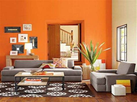 Find a fresh look with these living room color schemes. Living Room Paint Color with orange wall : Bonasty | Modern living room paint, Living room ...