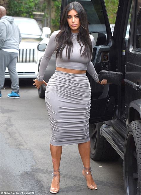 kim kardashian recycles go to crop top and skirt to film with khloe daily mail online
